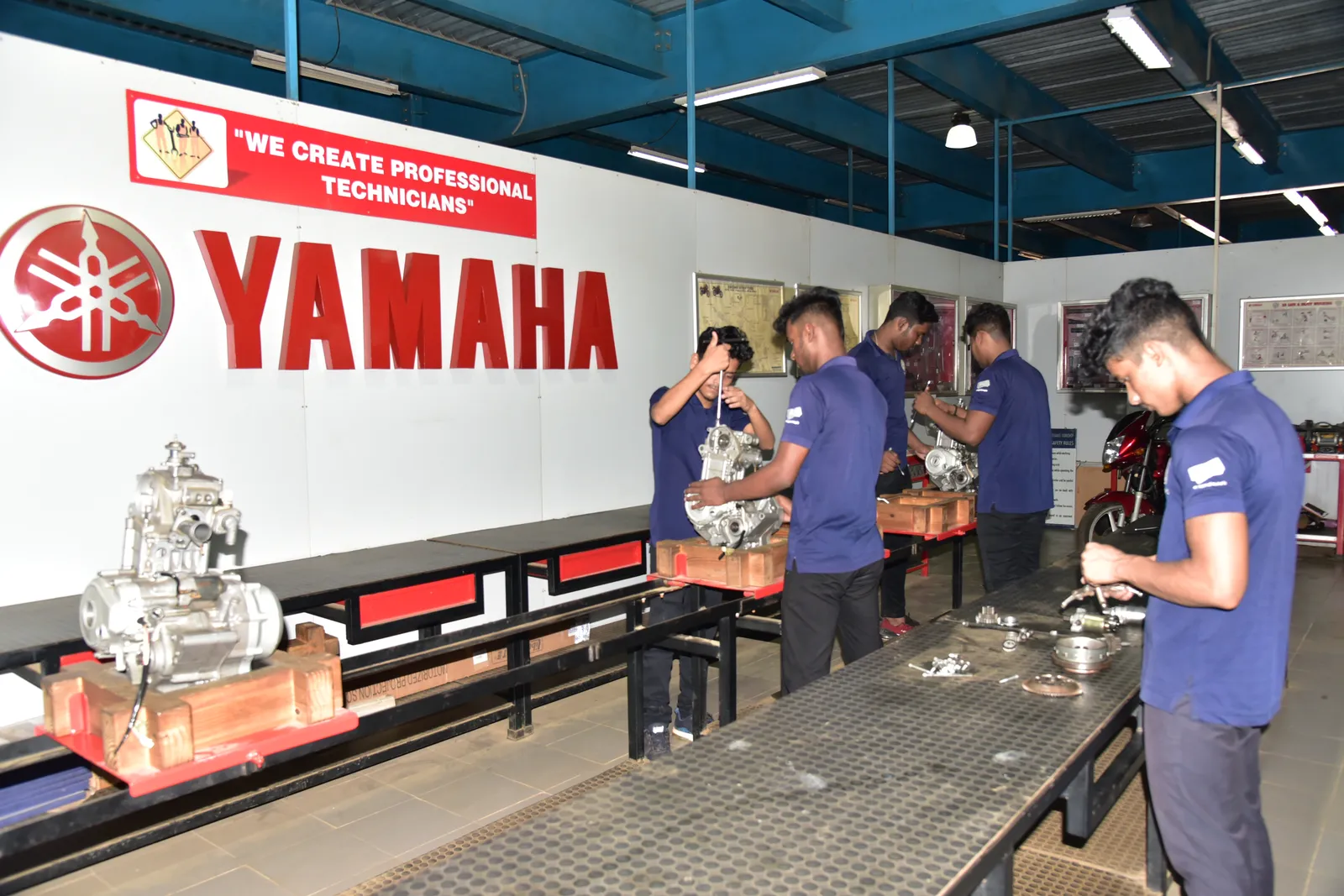 Yamaha service technicians training on motorcycle engines